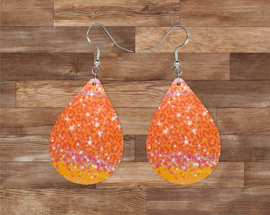 orange cheetah print and sparkly earrings